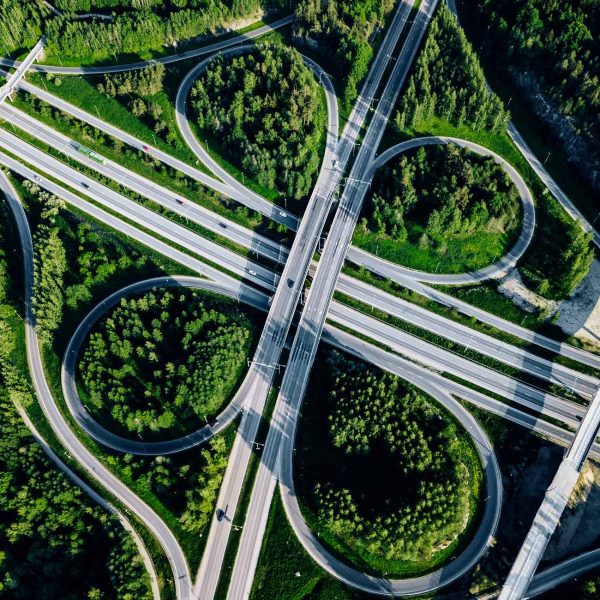 aerial-top-view-of-highway-and-overpass-with-green-B258TMQ.jpg